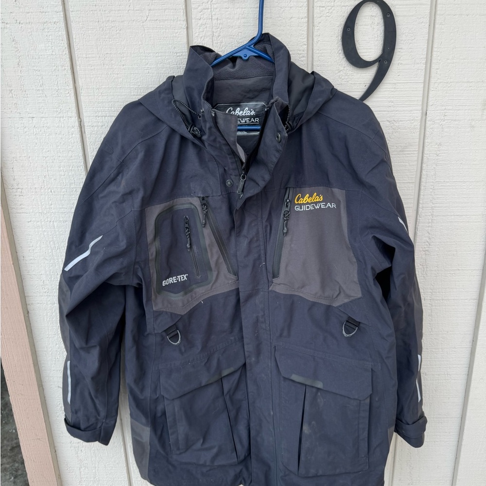 Cabella’s Guide wear Goretex fishing coat with neoprene cuffs